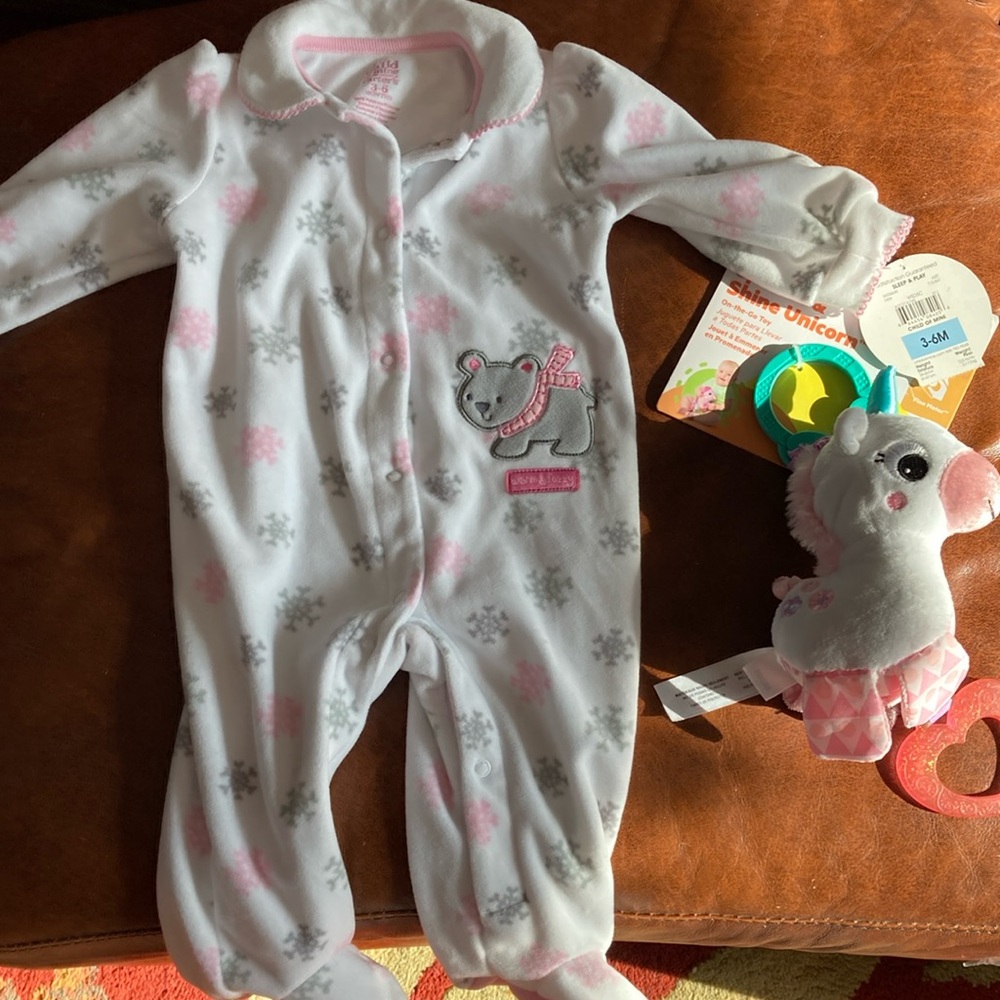 Carter’s 3 to 6 month one piece along with a toy